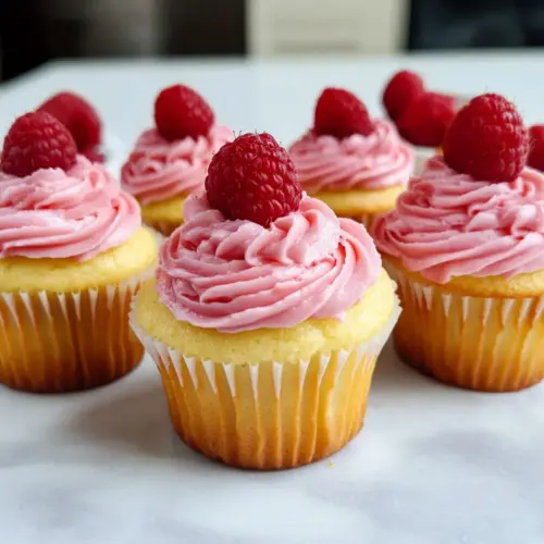 Lemon Cupcakes with Raspberry Buttercream Frosting